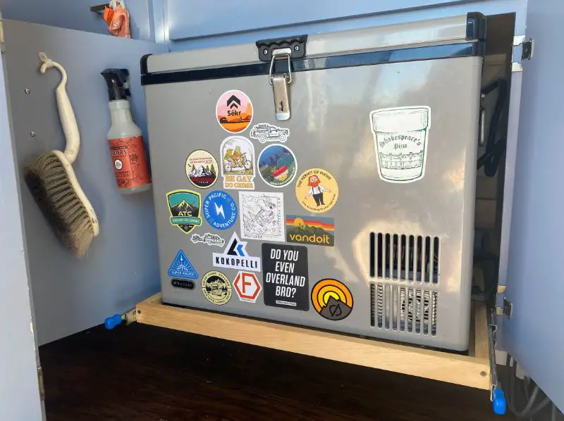 DIY Van Build Grey Mini Fridge Cooler With Stickers On It